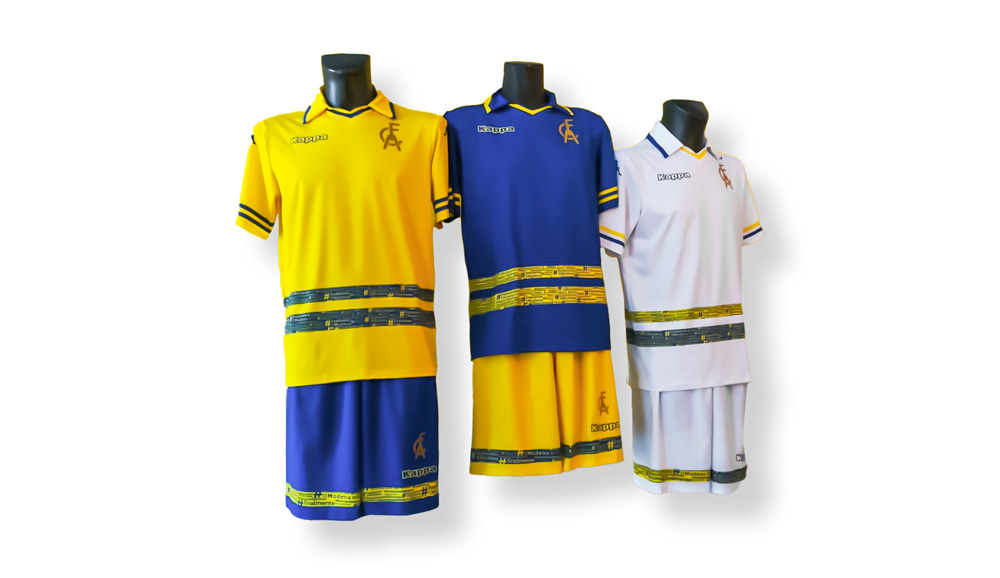 Modena FC, the new t-shirts. The usual kit that includes the home jersey with a yellow t-shirt  and blue socks; an away jersey with blue t-shirt and yellow socks together with a third white suite. The horrible thing is blue or yellow band with Modena FC written in some different fonts. 